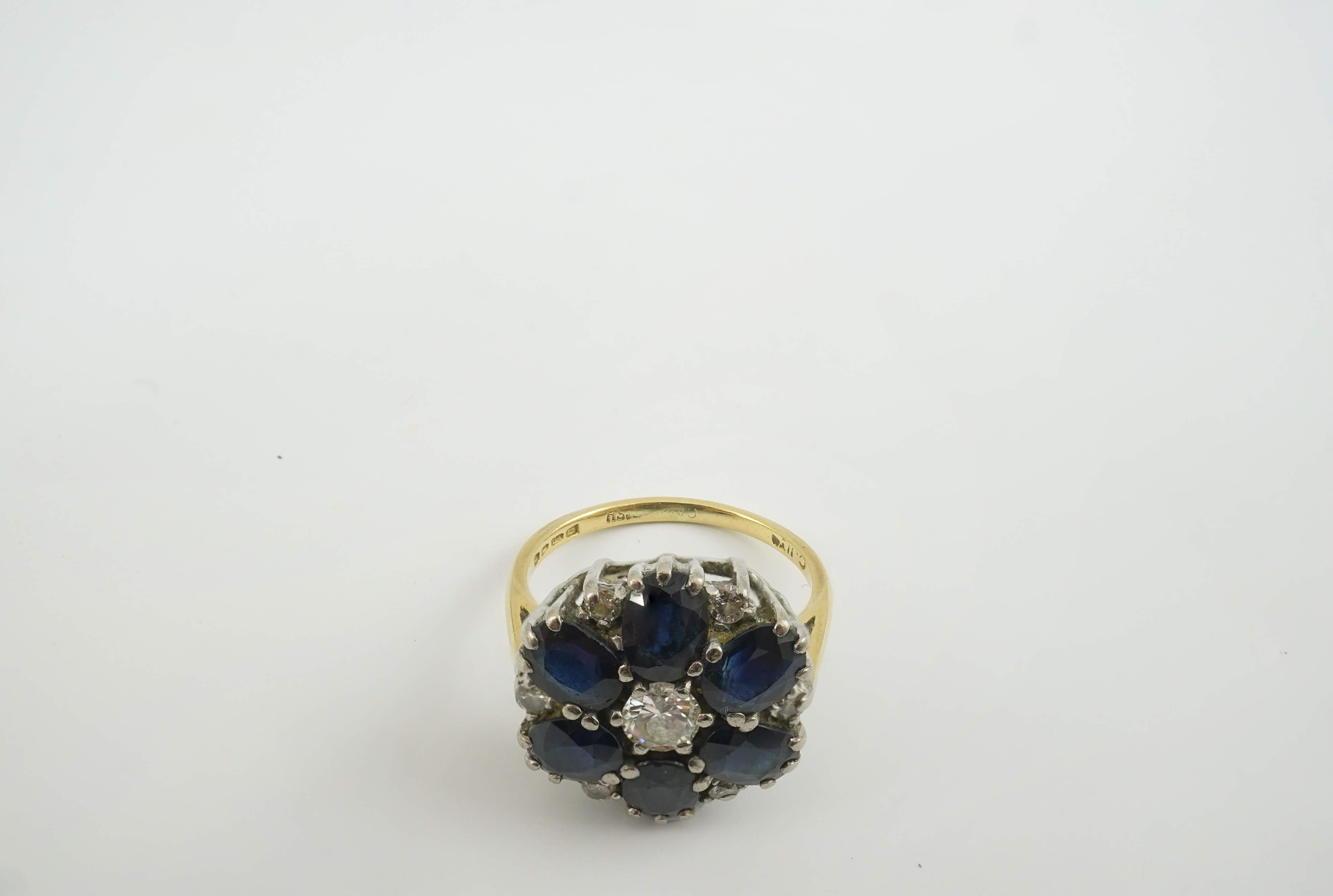 A 1970's 18ct gold, sapphire and diamond set circular cluster ring